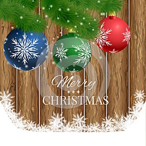 Christmas wooden background with fir branches and balls