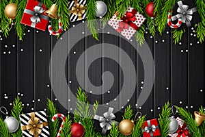 Christmas wooden background with fir branches and elements on dark background