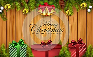 Christmas wooden background with fir branches and gift boxes