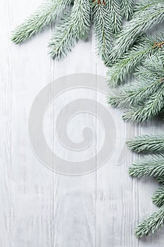 Christmas wooden background with fir tree