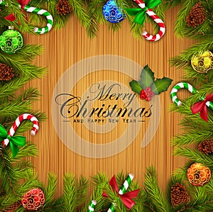 Christmas wooden background with fir tree branches and colorful balls