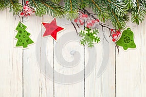 Christmas wooden background with fir tree and decor