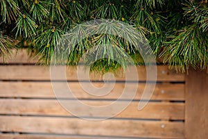 Christmas wooden background with fir tree. Wooden background. Christmas Wreath with Rustic Wood Background. Christmas