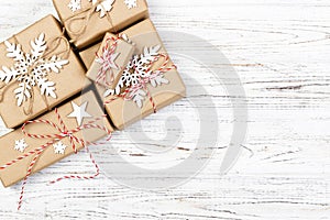 Christmas wooden background with gift boxes and decor. Top view with copy space for your text