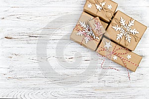 Christmas wooden background with gift boxes and decor. Top view with copy space for your text