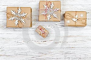 Christmas wooden background with gift boxes and decor. Top view with copy space for your text