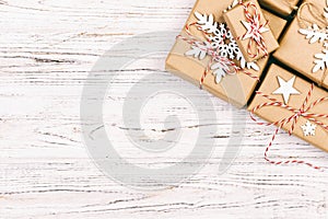 Christmas wooden background with gift boxes and decor. Top view with copy space for your text. Toned