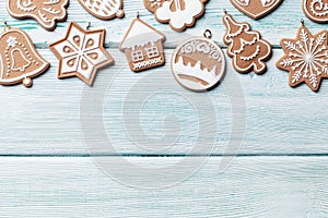 Christmas wooden background with gingerbread cookies