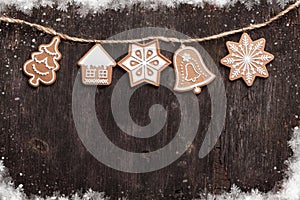 Christmas wooden background with gingerbread cookies