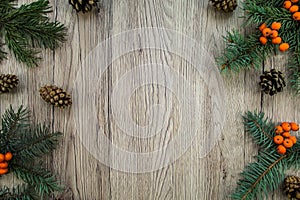 Christmas wooden background with natural decoration. Flat lay, top view