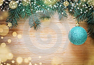 Christmas wooden background with pine and ball