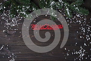 Christmas wooden background with snow fir tree.