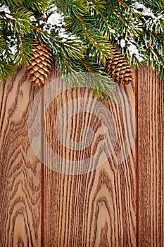 Christmas wooden background with snow fir tree