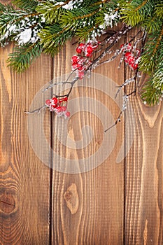 Christmas wooden background with snow fir tree