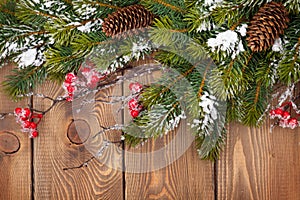 Christmas wooden background with snow fir tree