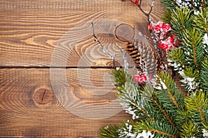 Christmas wooden background with snow fir tree