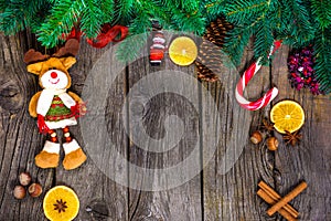 Christmas wooden background with snow fir tree. View copy space