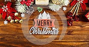 Christmas wooden background with snow fir tree. View with copy space . Copy space framed by Christmas tree branches, decorations,