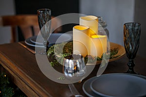 Christmas wooden festive table with burning candles