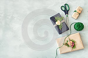 Christmas wrapping. Gift box, present with craft wrapping paper, twine, coniferous branches