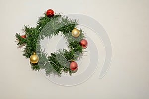 Christmas wreath of cones and apples, New Year`s decorations.