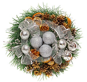 Christmas wreath of cones, silver balls and fir branches isolated on white background