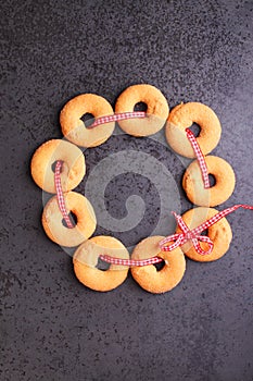 Christmas wreath: cookies decorated with a red ribbon