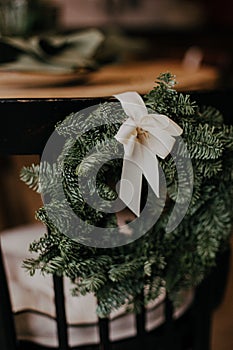 Christmas wreath in decoated interior. Christmas decor self made