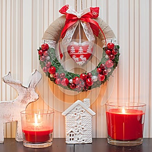 Christmas Wreath Decoration with red berries and red ribbon bow.