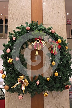 Christmas wreath with double bells on a pole