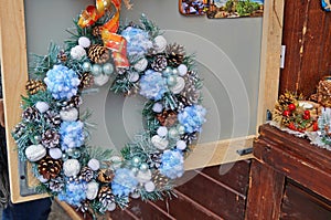 Christmas wreath of fir branches decorated with colorful Christmas balls