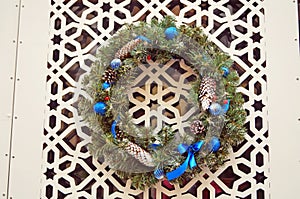 Christmas wreath of fir branches decorated with colorful Christmas balls