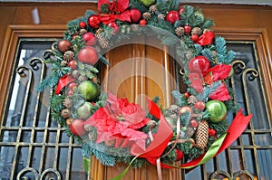 Christmas wreath of fir branches decorated with colorful Christmas balls