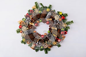 Christmas wreath with fir branches, pine cones and jingle bells