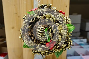 Christmas wreath from fir, pine and spruce twigs with cones, berries in a shop as background - Image