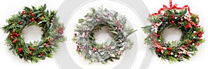 Christmas wreath of fresh natural spruce branch with red holly berries and decoration. New Year. Xmas holiday
