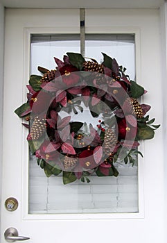 Christmas wreath hanging on front door