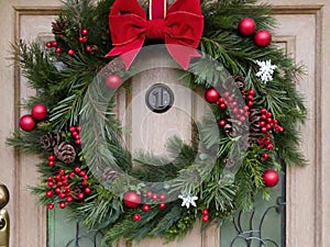 A Christmas wreath hanging on a front door,. Generated AI