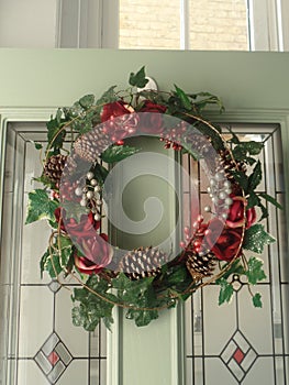 Christmas wreath hanging on front door