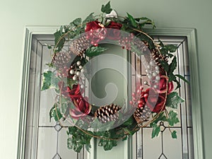 Christmas wreath hanging on front door