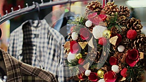 Christmas wreath hanging from rack