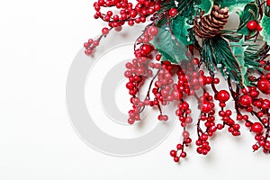 Christmas wreath of holly berries and evergreen isolated on white background