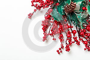 Christmas wreath of holly berries and evergreen isolated on white background photo