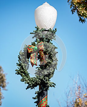 Close up of of a Christmas Wreath on a light post