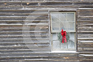 Christmas Wreath On Old Farmhouse