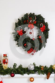 Christmas wreath over fireplace mantel photo