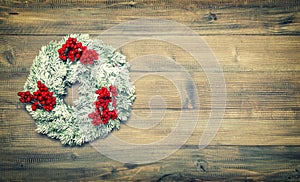 Christmas wreath with red berries. Festive vintage decoration