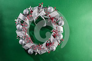 Christmas wreath in red with silver ribbon