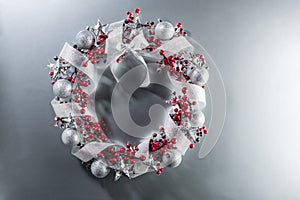 Christmas wreath in red with silver ribbon