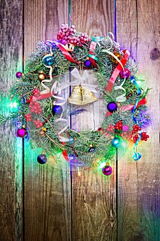 Christmas wreath on a rustic wooden wall